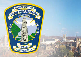 Yale Fire Marshal shield overlayed on central campus