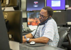 Facilities Operations staff member using service software, photo by Robert DeSanto